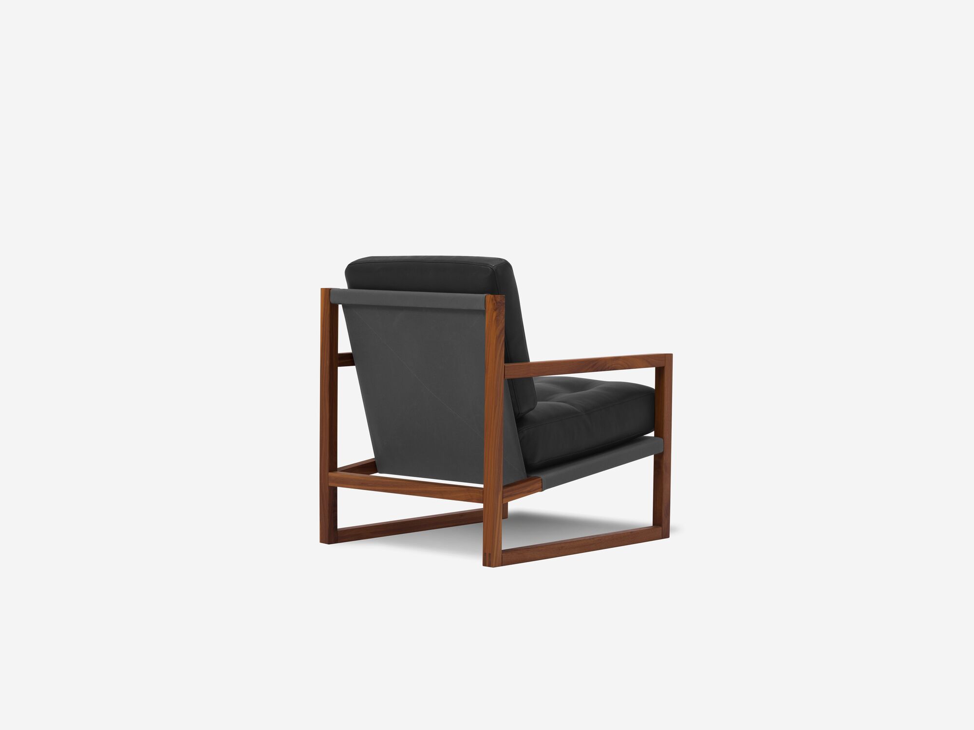 Black and walnut tufted lounge chair back angle view